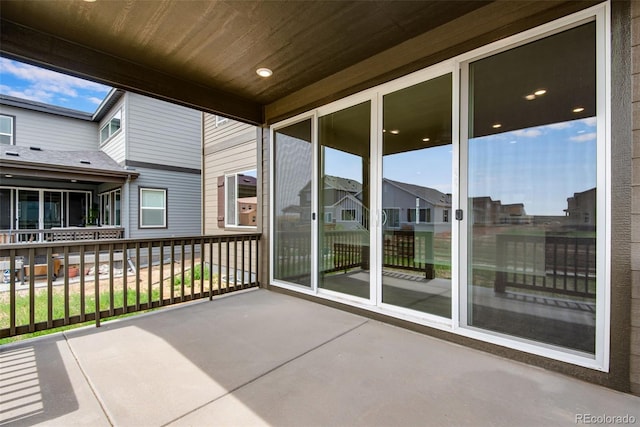 view of patio featuring a balcony