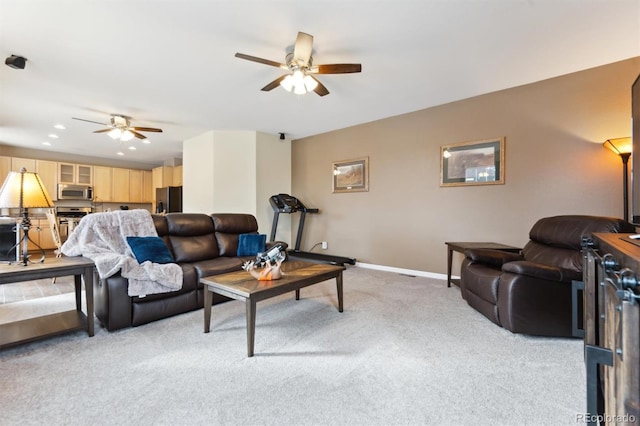 carpeted living room featuring ceiling fan