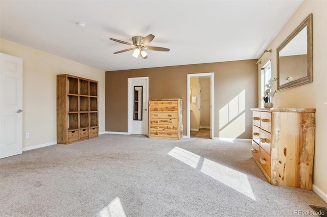 interior space with light colored carpet and ceiling fan