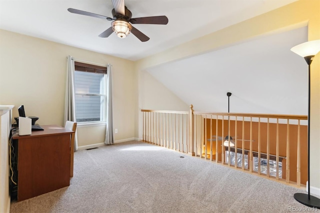 office space with ceiling fan, lofted ceiling, and light carpet