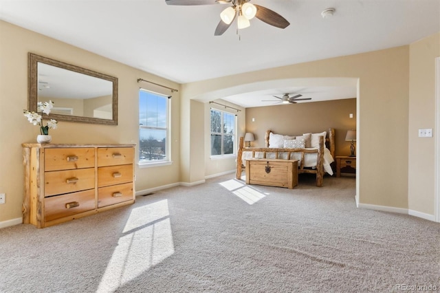 bedroom featuring ceiling fan and light carpet