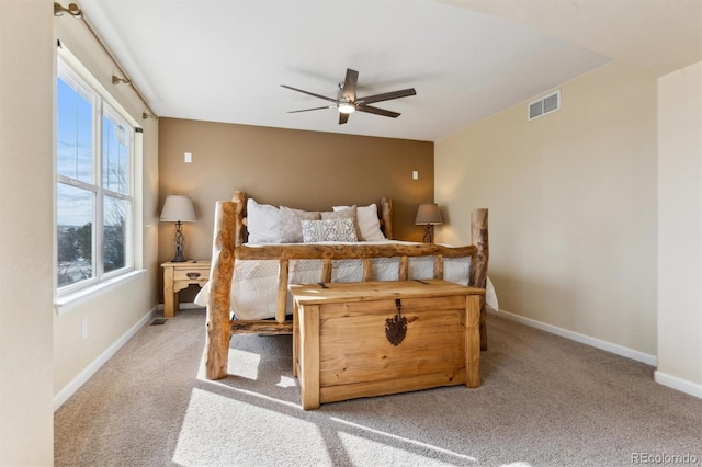 bedroom with light carpet and ceiling fan