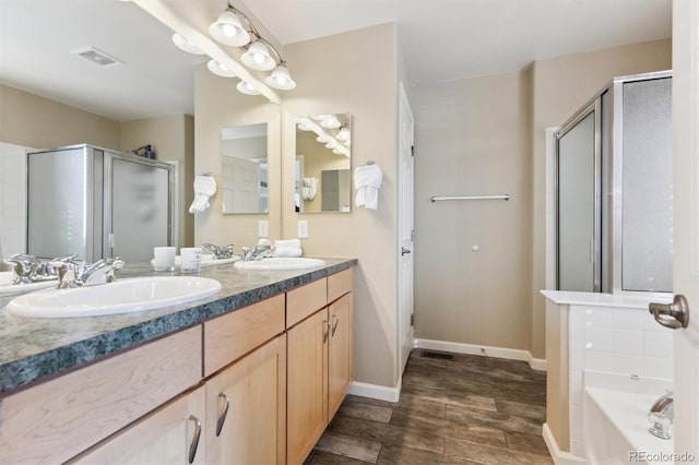 bathroom featuring independent shower and bath and vanity