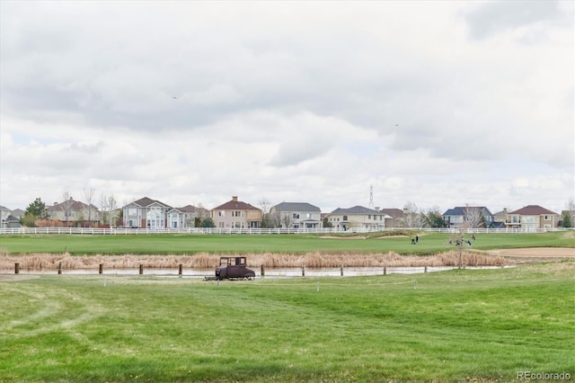 view of home's community featuring a yard