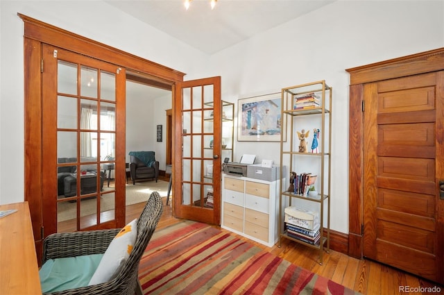 interior space with hardwood / wood-style floors and french doors