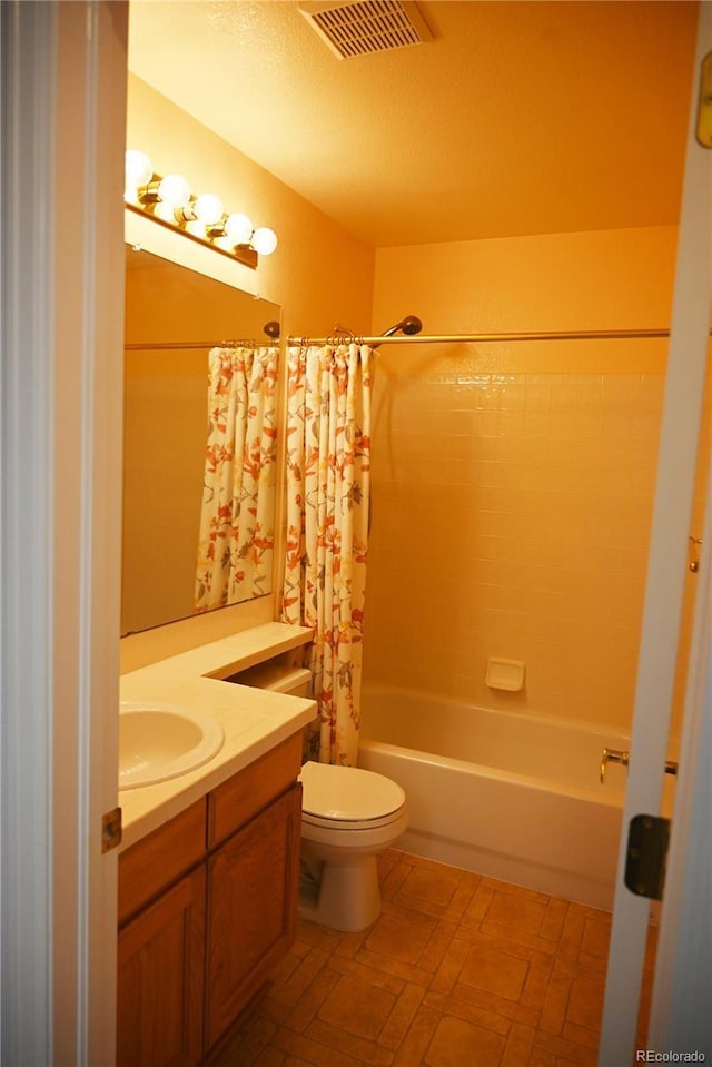 full bathroom featuring vanity, toilet, and shower / bathtub combination with curtain