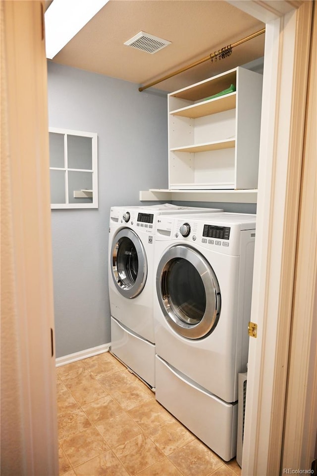 washroom with washing machine and dryer