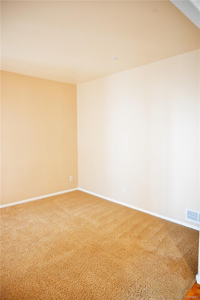 unfurnished room with carpet floors