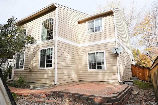 back of property with a patio area