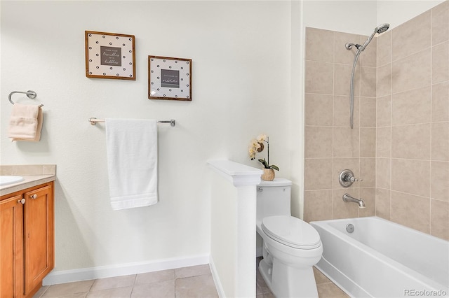 bathroom with toilet, vanity, bathing tub / shower combination, tile patterned flooring, and baseboards
