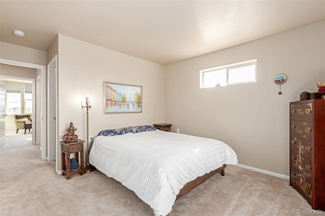 bedroom with light colored carpet