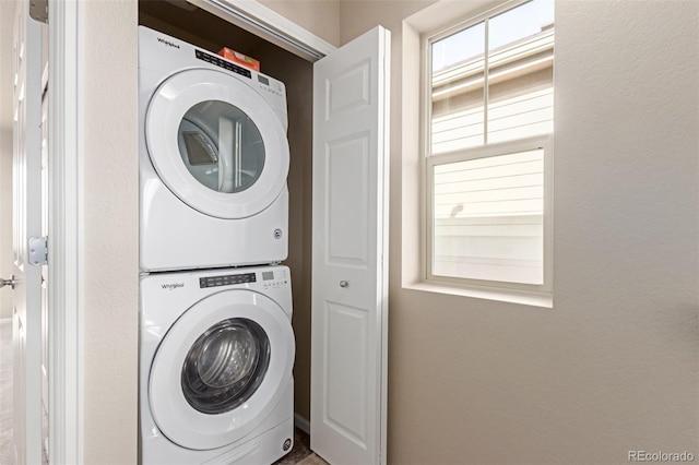 laundry area featuring stacked washer and dryer