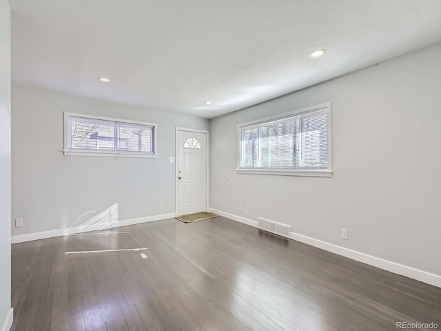 foyer entrance featuring dark hardwood / wood-style floors