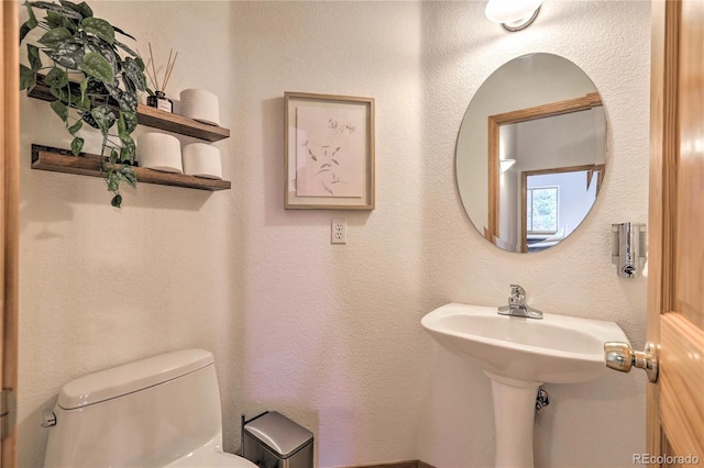 bathroom featuring toilet