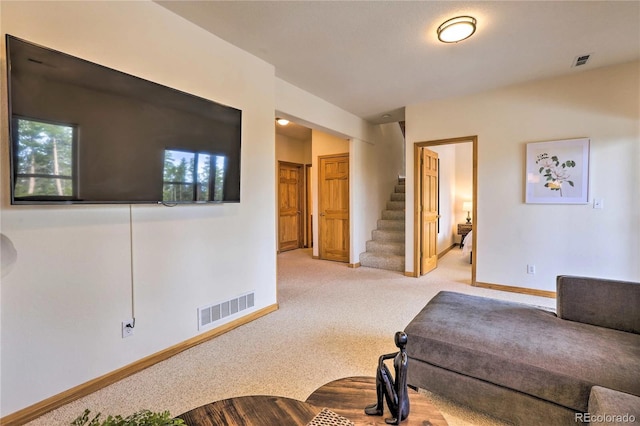 living area with light carpet