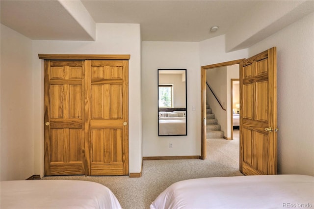 bedroom featuring light carpet