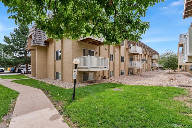 view of property's community with a yard