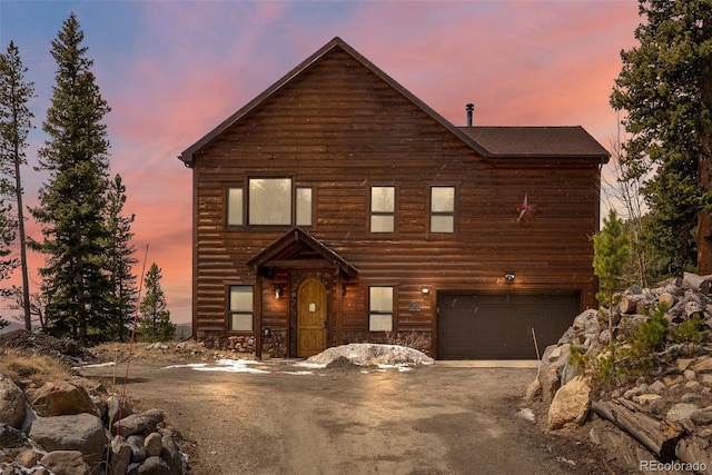 72 Overlook Ct, Idaho Springs, CO 80452 - rustic home featuring a garage, dirt driveway, and stone siding