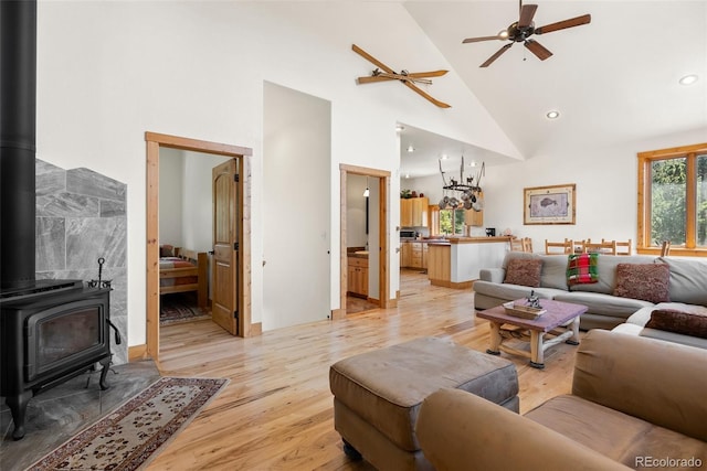 72 Overlook Ct, Idaho Springs, CO 80452 - living area with a wood stove, high vaulted ceiling, recessed lighting, a ceiling fan, and light wood-style flooring