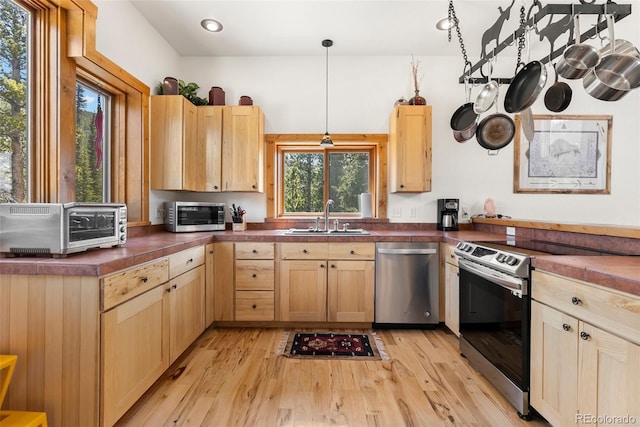 72 Overlook Ct, Idaho Springs, CO 80452 - kitchen with a sink, light brown cabinetry, stainless steel appliances, and light wood finished floors