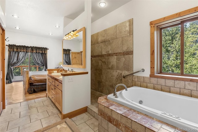 72 Overlook Ct, Idaho Springs, CO 80452 - full bathroom with a jetted tub, vanity, tile patterned floors, and recessed lighting