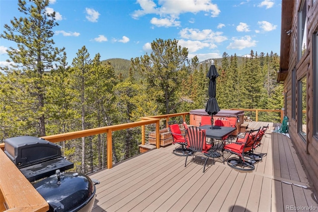 72 Overlook Ct, Idaho Springs, CO 80452 - deck featuring a view of trees, outdoor dining area, and grilling area
