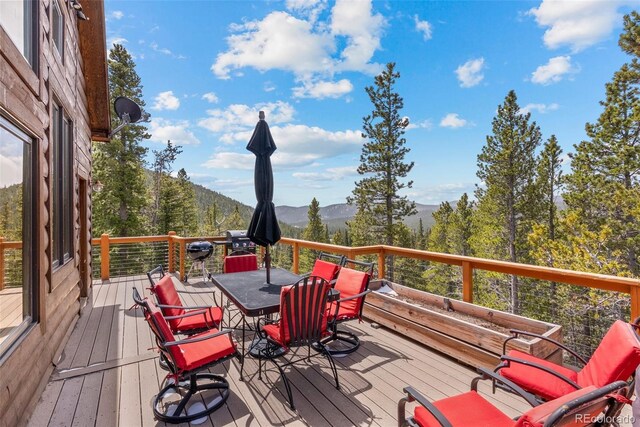 72 Overlook Ct, Idaho Springs, CO 80452 - wooden terrace with a mountain view and outdoor dining area