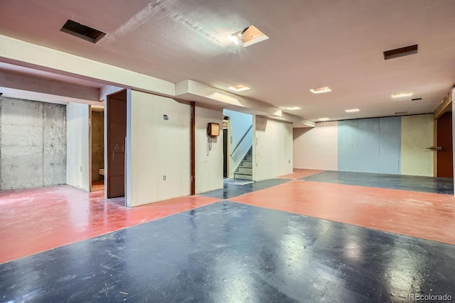 finished basement featuring stairs