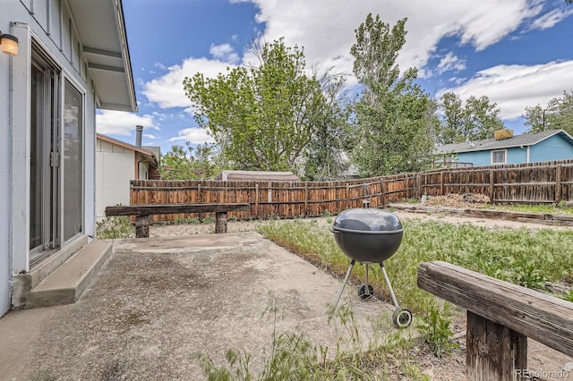 fenced backyard with a patio