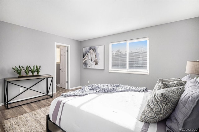 bedroom with hardwood / wood-style flooring