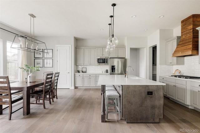 27653 E Euclid Dr, Aurora, CO 80016 - kitchen featuring stainless steel appliances, a sink, a chandelier, backsplash, and recessed lighting