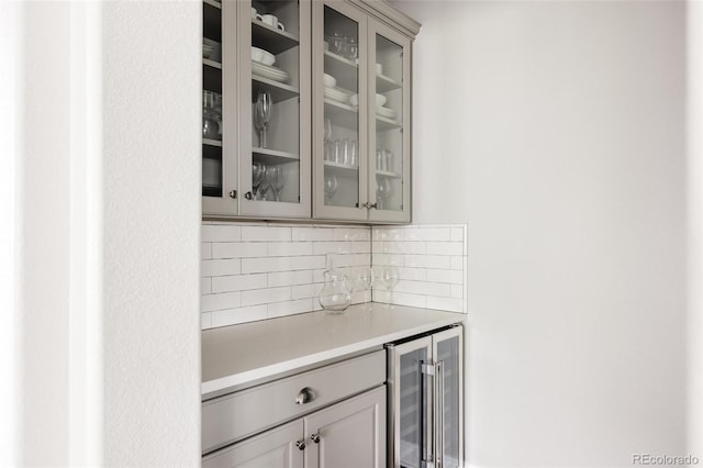 27653 E Euclid Dr, Aurora, CO 80016 - indoor dry bar with wine cooler and backsplash