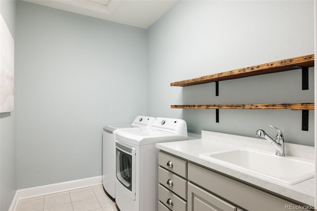27653 E Euclid Dr, Aurora, CO 80016 - washroom featuring washing machine and clothes dryer, light tile patterned floors, baseboards, and cabinet space