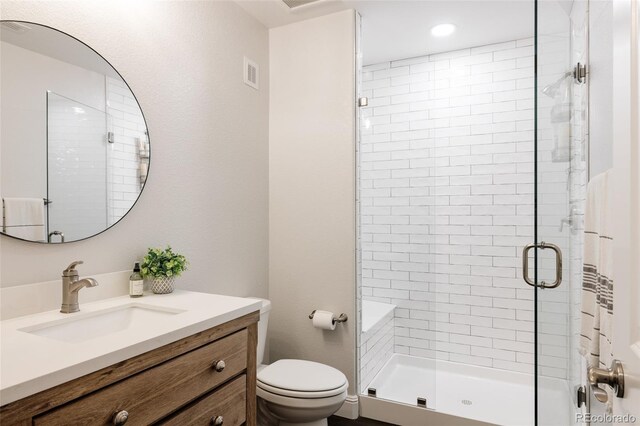 27653 E Euclid Dr, Aurora, CO 80016 - bathroom with a stall shower, toilet, and vanity