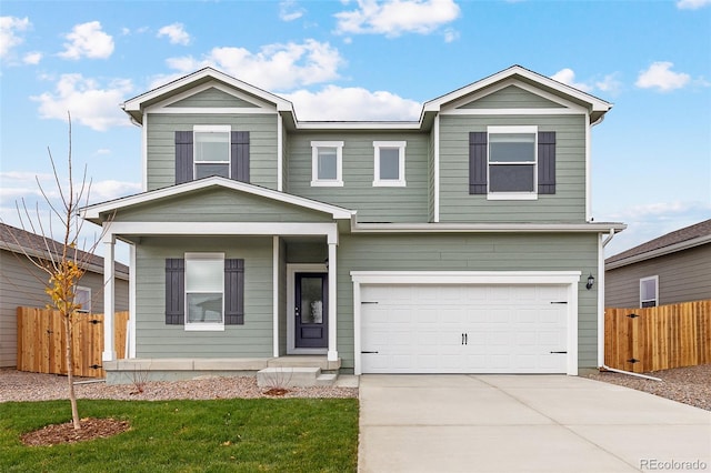 2145 Alyssa St, Fort Lupton, CO 80621 - view of front of home featuring an attached garage, concrete driveway, and covered porch
