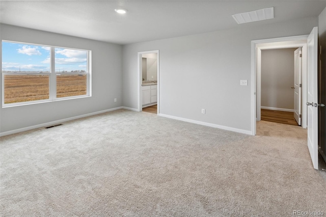 2145 Alyssa St, Fort Lupton, CO 80621 - unfurnished bedroom featuring carpet, baseboards, and ensuite bath
