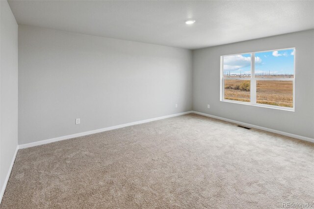 2145 Alyssa St, Fort Lupton, CO 80621 - carpeted empty room featuring baseboards