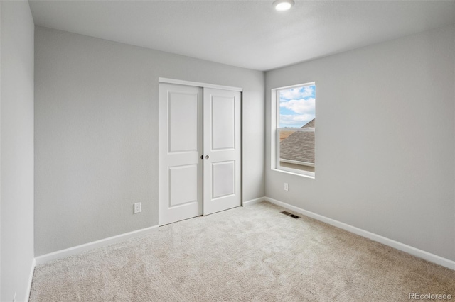 2145 Alyssa St, Fort Lupton, CO 80621 - unfurnished bedroom with carpet flooring, a closet, and baseboards