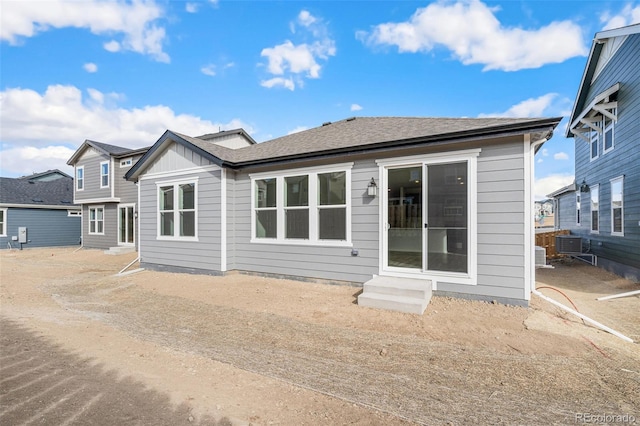 back of property with central AC unit