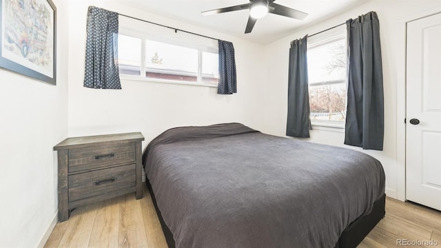 bedroom featuring ceiling fan and light hardwood / wood-style flooring