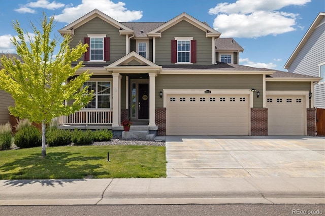 16341 Clayton St, Thornton, CO 80602 - craftsman-style home with brick siding, concrete driveway, a front yard, covered porch, and a garage