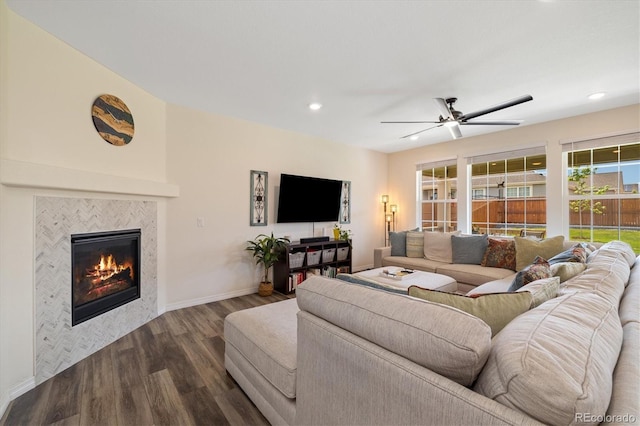 16341 Clayton St, Thornton, CO 80602 - living room featuring dark wood-style flooring, a tile fireplace, ceiling fan, and recessed lighting