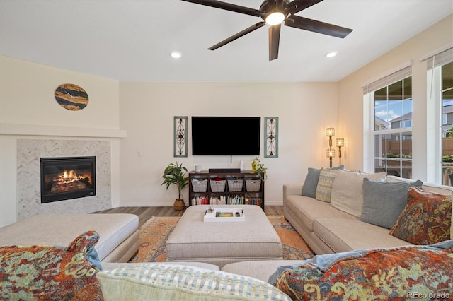 16341 Clayton St, Thornton, CO 80602 - living area with wood finished floors, ceiling fan, recessed lighting, and a tile fireplace