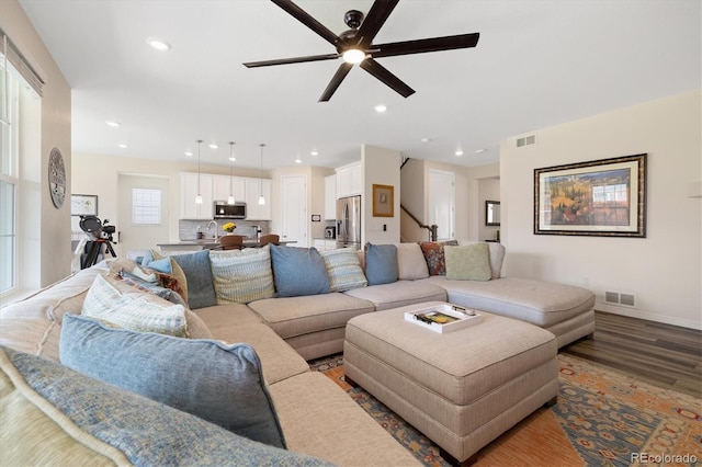 16341 Clayton St, Thornton, CO 80602 - living area featuring wood finished floors, ceiling fan, and recessed lighting