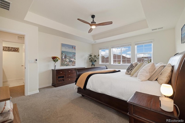 16341 Clayton St, Thornton, CO 80602 - carpeted bedroom featuring a tray ceiling and a ceiling fan