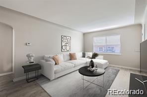 384 S Decatur St, Denver, CO 80219 - living area featuring wood finished floors and arched walkways
