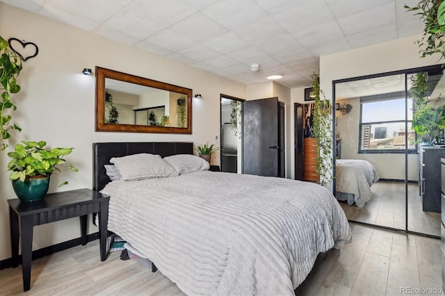 1301 Speer Blvd Unit 1108, Denver, CO 80204 - bedroom with wood finished floors and baseboards