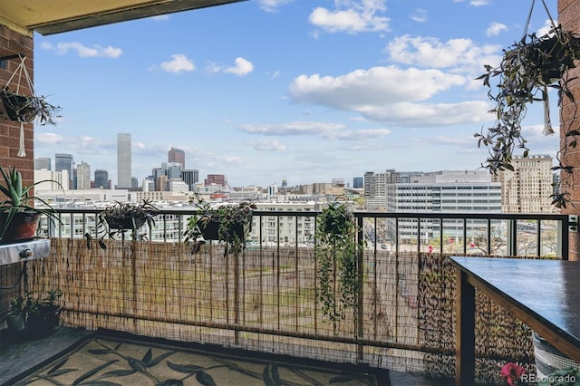 1301 Speer Blvd Unit 1108, Denver, CO 80204 - view of patio / terrace featuring a skyline view and a balcony