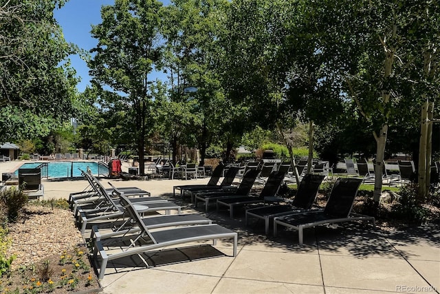 1301 Speer Blvd Unit 1108, Denver, CO 80204 - view of patio / terrace with a community pool and view of wooded area