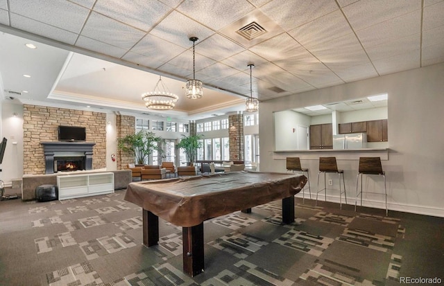 1301 Speer Blvd Unit 1108, Denver, CO 80204 - game room with billiards table, a warm lit fireplace, carpet flooring, ornamental molding, and a raised ceiling